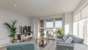The well equipped living room has a modern and comfortable style