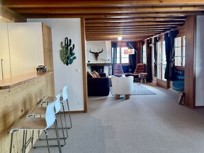 kitchen by the living room with a bar 
