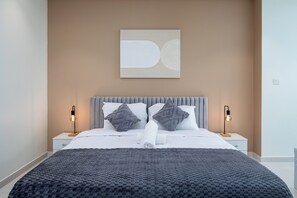 Elegant master bedroom featuring luxurious furnishings