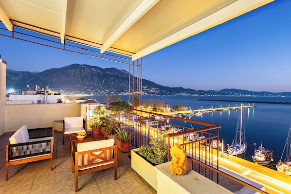 Stunning Night View of the Messinian Bay and Tatgetus Mountain from the Outdoor Sitting area