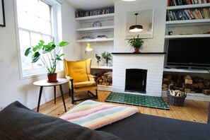 Open plan living room with log burner