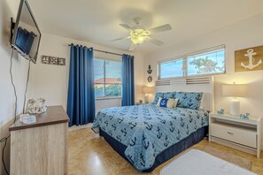 - Charming nautical themed bedroom with a cozy queen size bed & stylish décor
- Relax & unwind with soft bedding, blackout curtains & a ceiling fan for comfort
- Entertainment ready with a smart TV & a peaceful ambiance for a great night's sleep