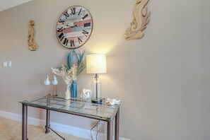- Warm and inviting entryway with charming coastal touches and elegant decor
- Thoughtfully styled with beachy accents, soft lighting, and a unique rustic clock
- Perfect welcome into a beautifully designed home with relaxing coastal vibes