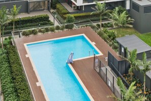 Take a refreshing dip in the shared pool, the perfect spot to cool off or enjoy a lazy afternoon under the sun.
