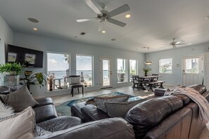Comfy oversized couches, Smart TV, & amazing bay views = the heart of the home. 