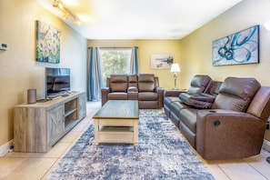 Comfortable living room with reclining couches- perfect for relaxing after a long day