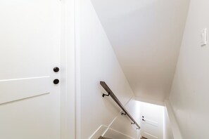 Stairwell to basement suite.