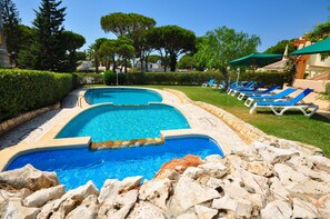 Pool area and sun loungers