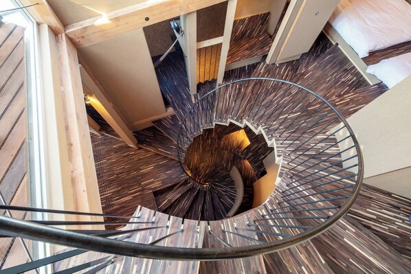 Spiral staircase in the center of the room