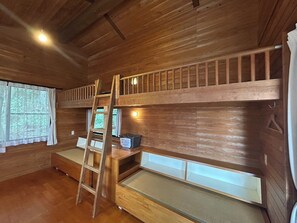 An open-ceiling bedroom. We all lay our pillows side by side. It reminds me of my school days!