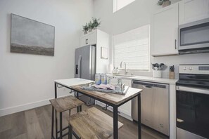 Beautifully appointed kitchen with island for additional seating and counter space.