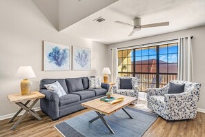 The living room has a beautiful picture window for natural light!