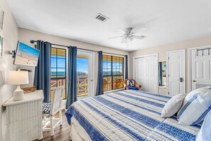 You have breathtaking views of the gulf and the shoreline from the picture windows and the 
all-glass french door that takes you out to the second balcony.