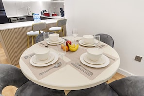 Dining Area: Enjoy meals with style at this chic table set for delightful gatherings!