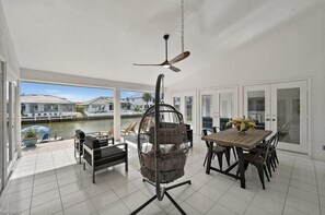 Enjoy sitting and relaxing with some cocktails overlooking the sun drenched water