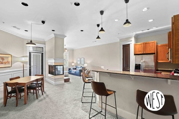 This floor plan features a well-lit dining table for meals, work, and hanging out.