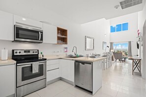 Cook, dine, & relax in this open-concept space filled with natural light