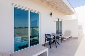 Enjoy your spacious balcony, perfect for sipping morning coffee or unwinding at sunset - Relax on comfortable seating while taking in peaceful open air views and breezes - Inviting outdoor space combines tranquility and a touch of charm