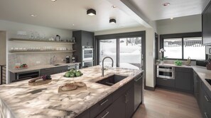 Gourmet Kitchen with back-lighted quartz counter island