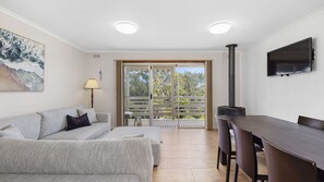 Open plan living dining area, with access on to balcony.