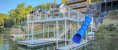 Two story dock with a slide and floating mat.