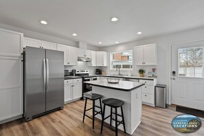 Great kitchen with island seating and easy access to the back yard