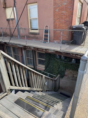 Stairway down to main apartment door used for check-in and check-out.