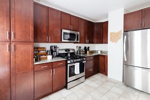 The clean, organized layout of the kitchen is perfect for both cooking and entertaining.