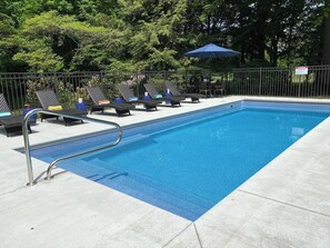 Heated pool with seating ledges at each end.