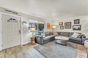 Living room: Smart TV w/ cable, wood-burning fireplace (no wood provided), central heat, no A/C