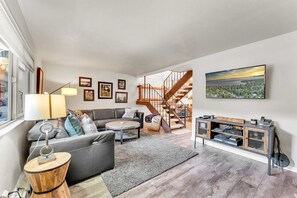 Living room: Smart TV w/ cable, wood-burning fireplace (no wood provided), central heat, no A/C