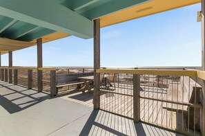 Savor alfresco dining on the patio with breathtaking beach views. 