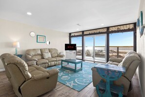 This seafoam-toned living room is a serene escape for beach lovers
