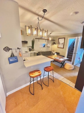 Cozy Open-Plan living area and kitchen. No need for anyone to miss the action.