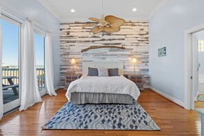 Wake up to ocean views in this charming bedroom with lighting and a comfy bed!