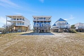 A stilted gem with ocean hues, stunning views, and coastal breezes awaits!