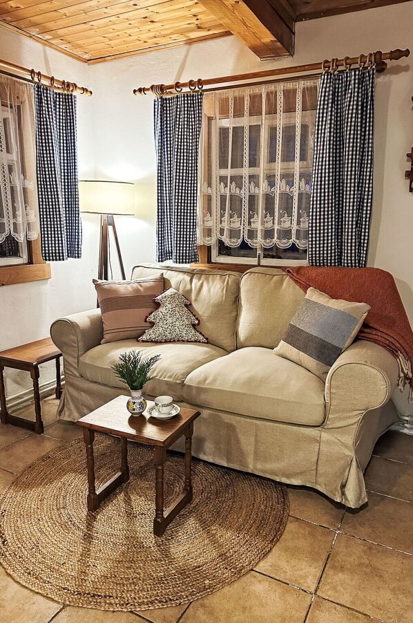 Furniture, Interior Design, Textile, Flooring, Couch, Brown, Room, Floor, Living Room, Window Treatment