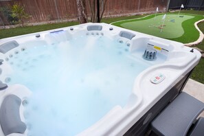 Relax or play? Why not both! Soak in the hot tub or challenge your crew to a round of putt-putt—fun and relaxation guaranteed!