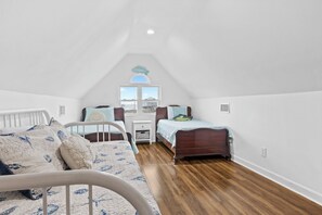 Twin beds and a trundle—perfect for family or a cozy loft retreat! #LoftLiving