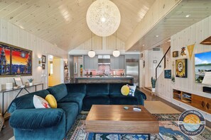 Natural light fills the open living area, connecting to the kitchen.