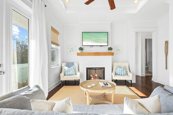 Relax by the cozy gas fireplace and queen memory foam sofa bed