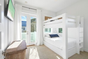 Custom Queen/Queen bunk beds, each with its own reading light and USB charger