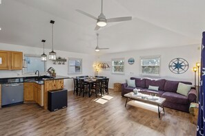Livingroom - Perfect for unwinding, the coastal decor is just one of the many reason to cozy up with the family.