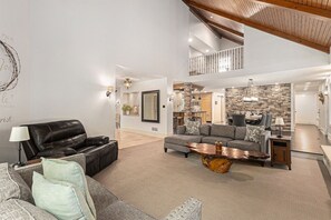 The living room is open to the kitchen and dining area