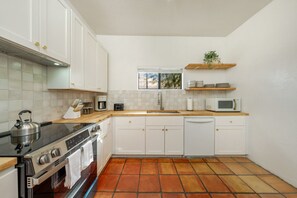 Updated kitchen, fully stocked and ready for your stay