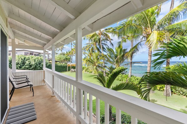 Relax on the breezy lanai with views of swaying palms and the ocean.