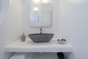 A stylish en-suite bathroom for ultimate relaxation and convenience.