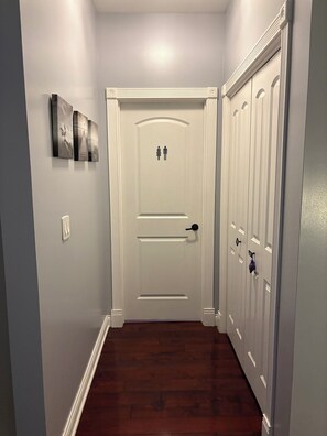 Coat closet and half bathroom. 