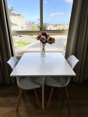 The dining area is part of an open plan kitchen and lounge space.