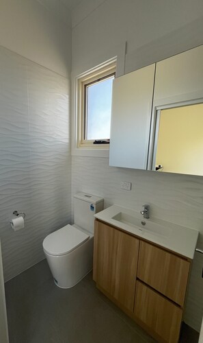 The bathroom is clean, modern and light, and makes good use of space.